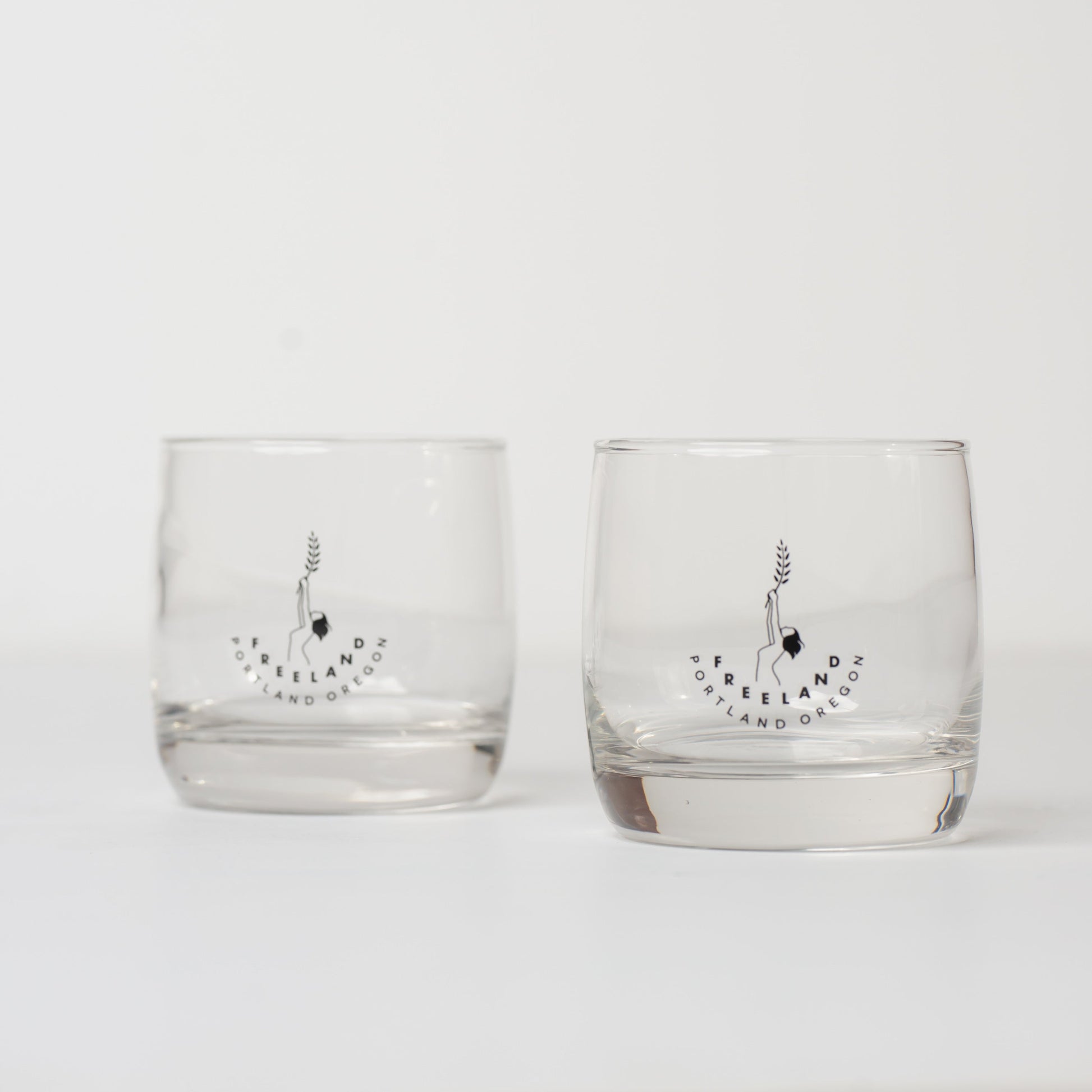 Pair of Freeland Spirits logo rocks glasses
